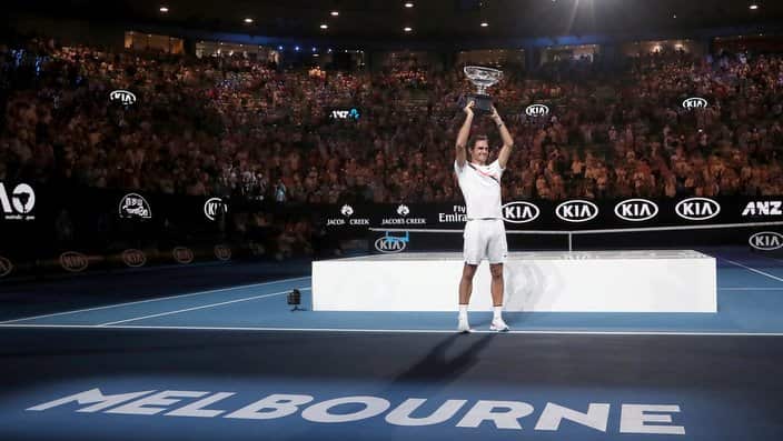 Switzerland's Roger Federer holds his trophy up after defeating Croatia's Marin Cilic in the men's singles final at the Australian Open tennis championships in Melbourne, Australia, Sunday, Jan. 28, 2018. (AP Photo/Dita Alangkara)