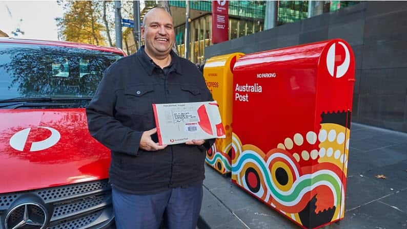 Australia Post Indigenous Manager Chris Heelan with the new packaging.