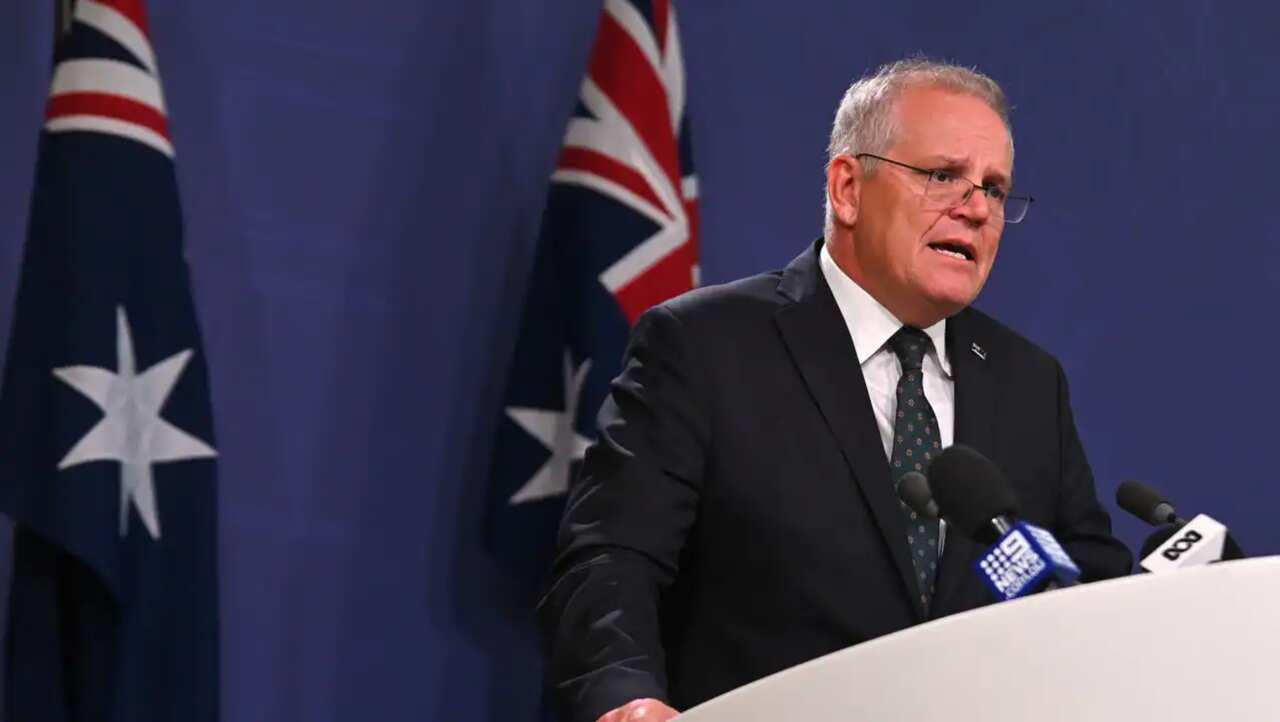 Australia's Prime Minister Scott Morrison speaks to the media to announce sanctions on top Russian officials Source: AFP / STEVEN SAPHORE/AFP via Getty Images