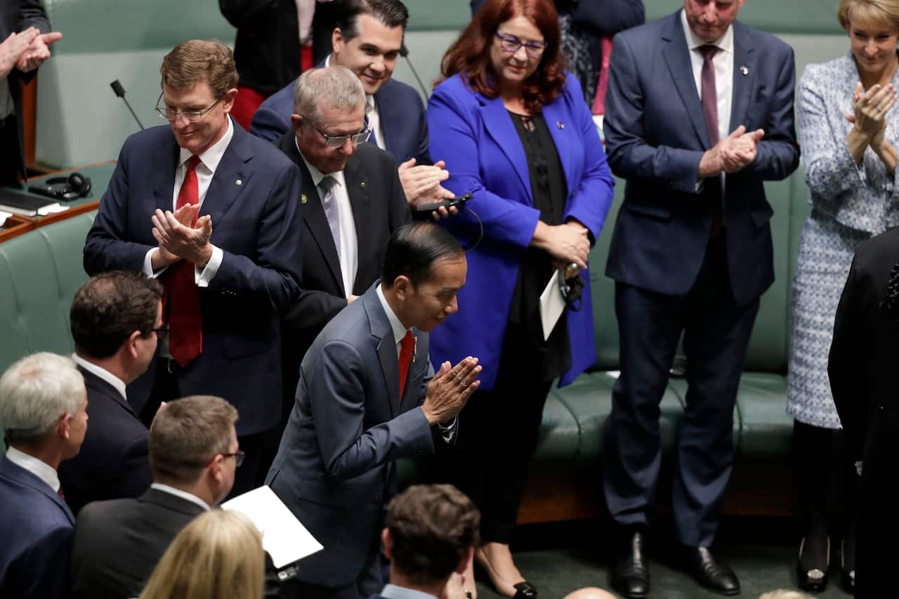 Indonesian President Joko Widodo is welcomed as he enters Parliament in Canberra.