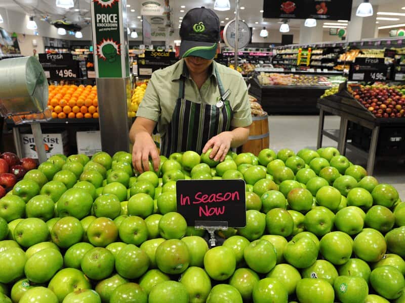 An employee inside a Woolworths grocery store in Brisbane