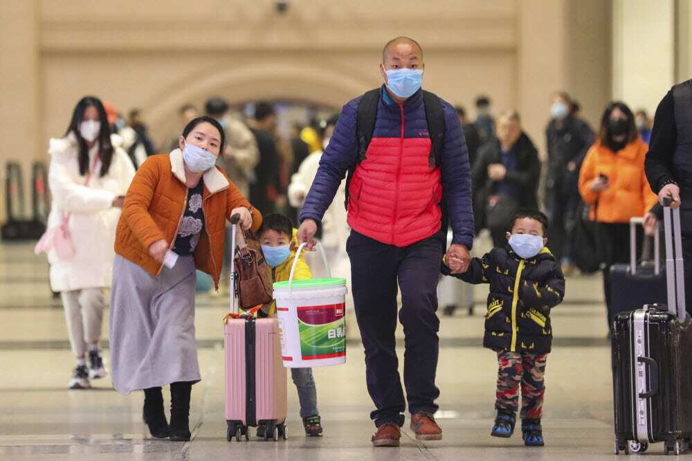 Travelers at Hankou Railway Station in Wuhan in southern China's Hubei province.