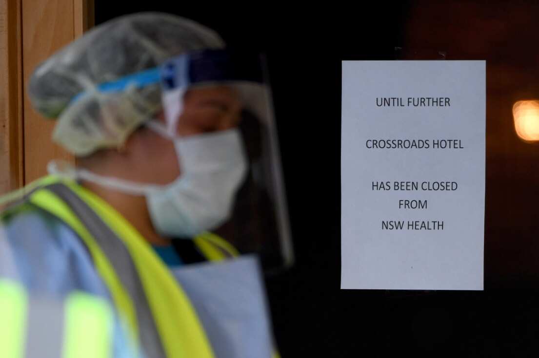 COVID-19 signage is seen at the Crossroads Hotel in Sydney, Saturday, July 11, 2020