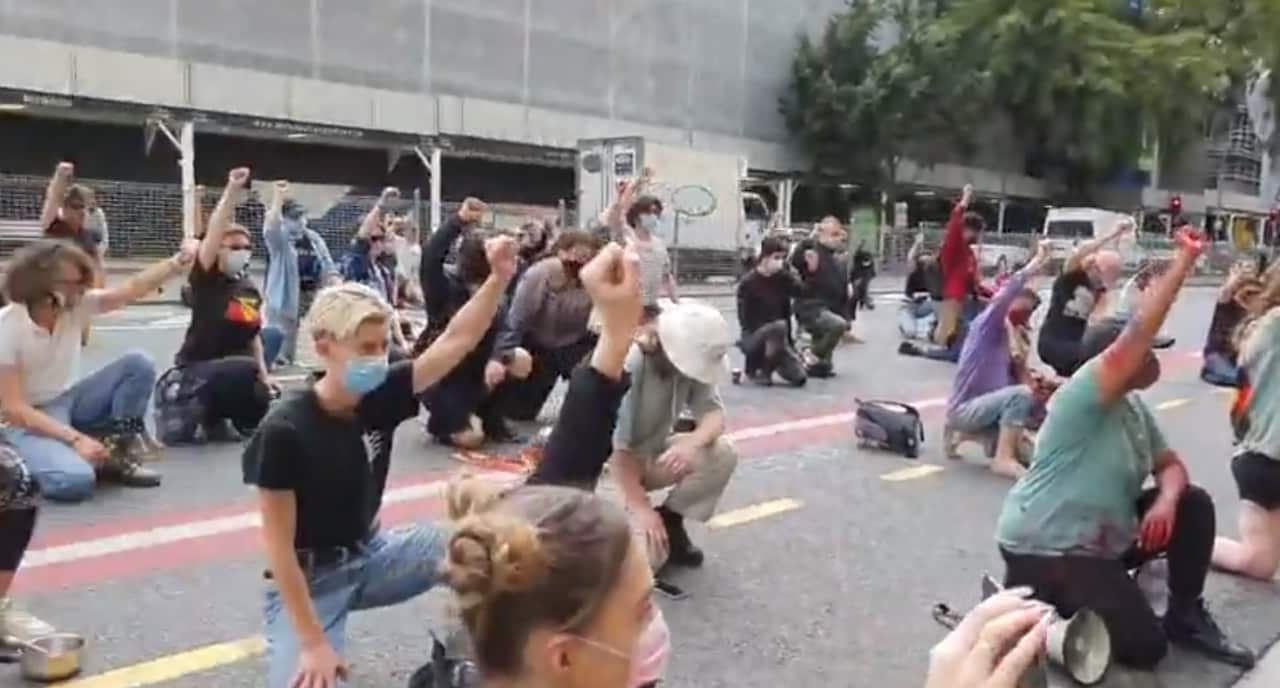 Protesters outside Queensland Police headquarters in Brisbane 