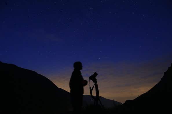 A photographer prepares to take pictures of the annual Perseid meteor shower