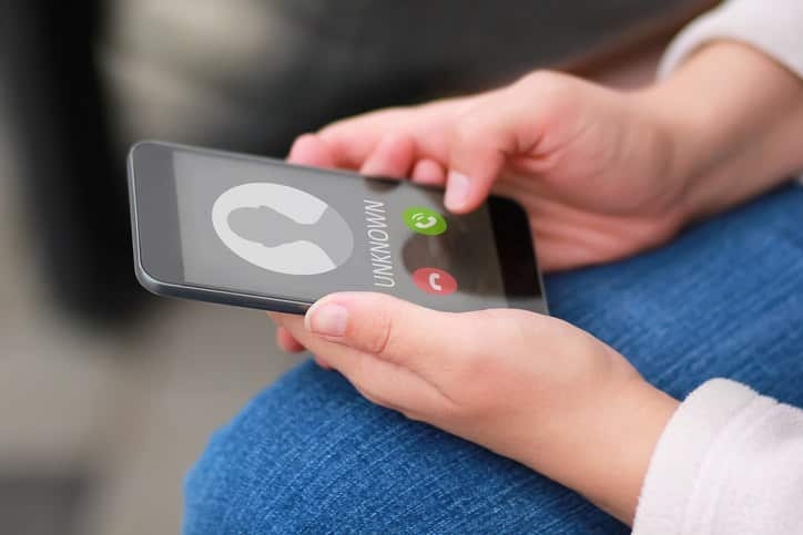 Close up of woman's hands with smartphone and unknown incoming phone call on it. (Photo by KSTU-TV/iStockphoto/TNS/Sipa USA).