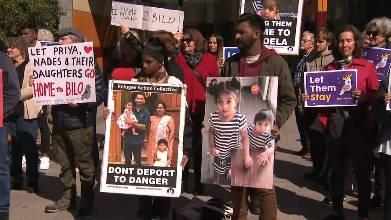 Supporters of the Tamil family outside the High Court ahead of the decision. 