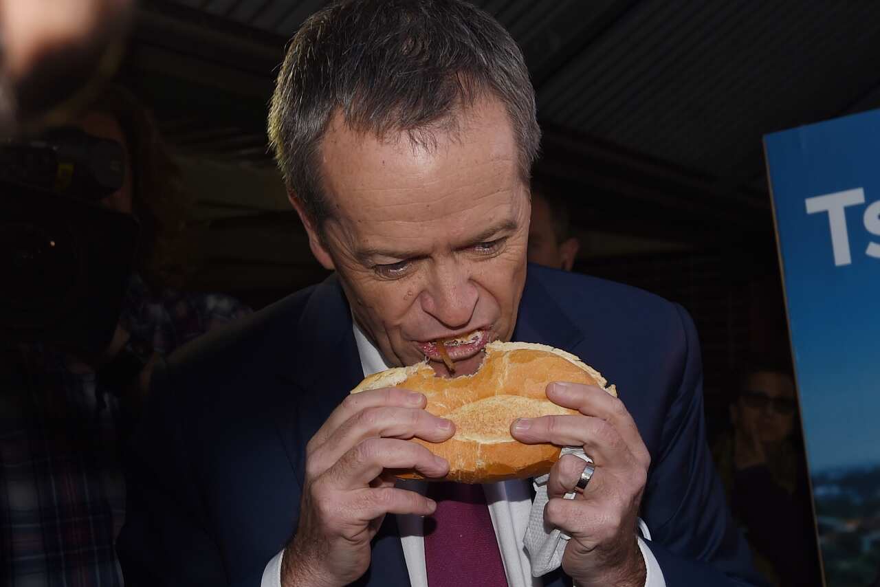 Then-Labor leader Bill Shorten eating a sausage at a Sydney polling booth on election day in 2016.