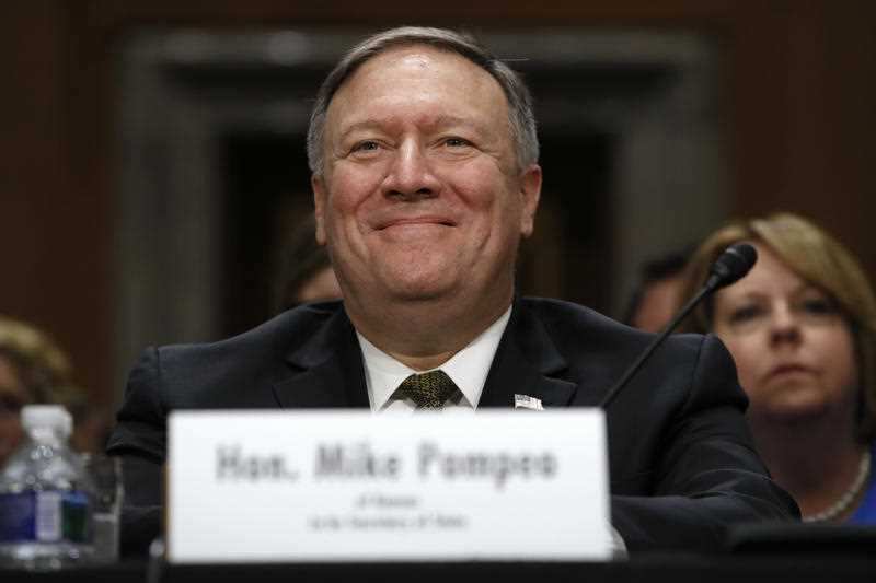 Secretary of State-designate Mike Pompeo smiles after his introduction before the Senate Foreign Relations Committee during a confirmation Thursday, April 12, 2018.
