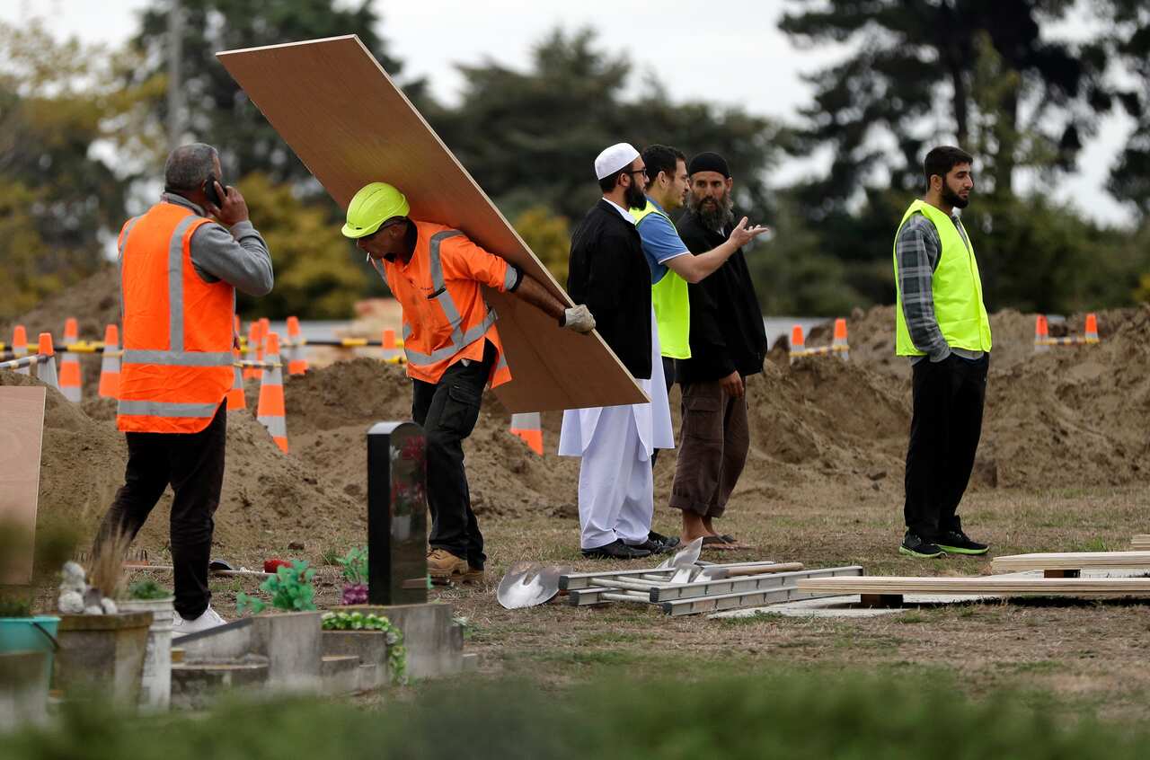 Muslims oversee the excavating of graves at a Muslim cemetery in Christchurch, New Zealand.