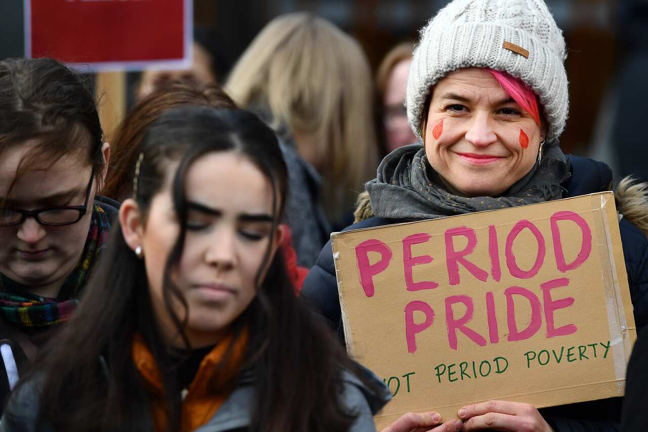 Campaigners and activists rally outside Scottish Parliament in support of a government bill to tackle period poverty in February 2020.