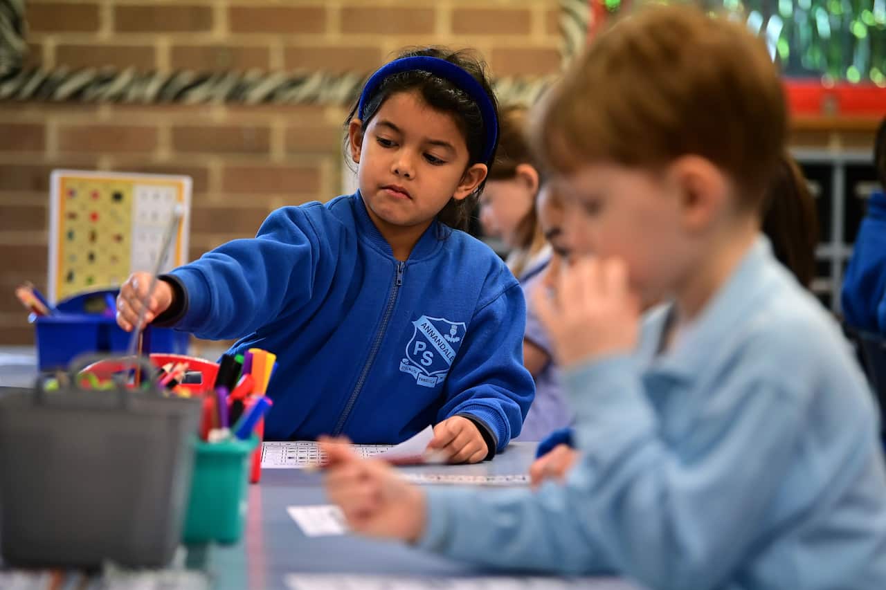 Kindergarten students work on an activity at Annandale Public School in Sydney on Monday.