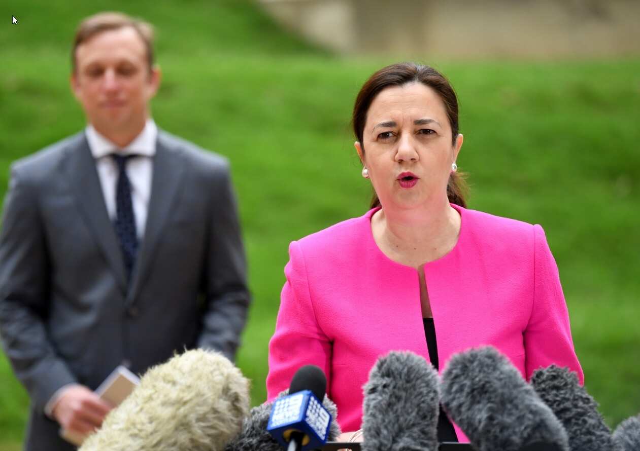 Queensland Premier Annastacia Palaszczuk, flanked by Deputy Premier and Health Minister Steven Miles. 