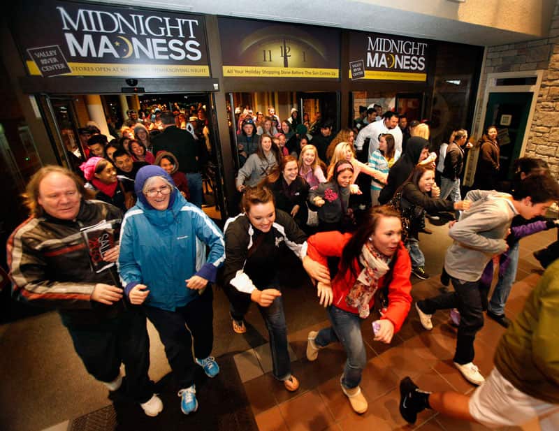 US Shoppers race into a store at midnight for Black Friday sales. (AAP)