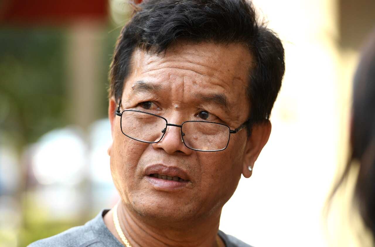 Van Nguyen, 59, a friend of the victim speaks to media as NSW Police attend the scene of a shooting at a cafe at Bankstown City Plaza (AAP)