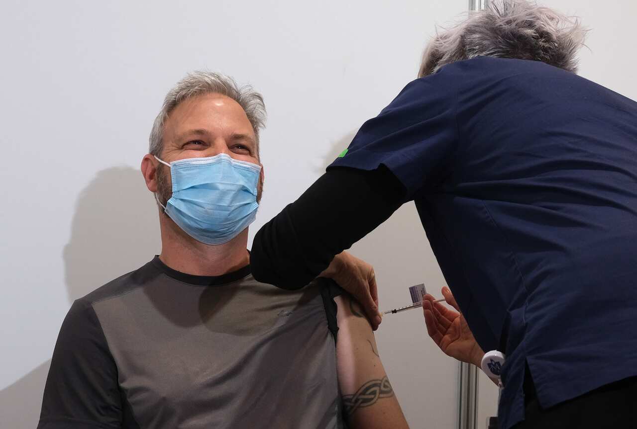 Victorian Chief Health Officer Brett Sutton receives his first COVID-19 vaccination at the Royal Exhibition Building in Melbourne, Wednesday, April 21, 2021. (AAP Image/Luis Ascui) NO ARCHIVING