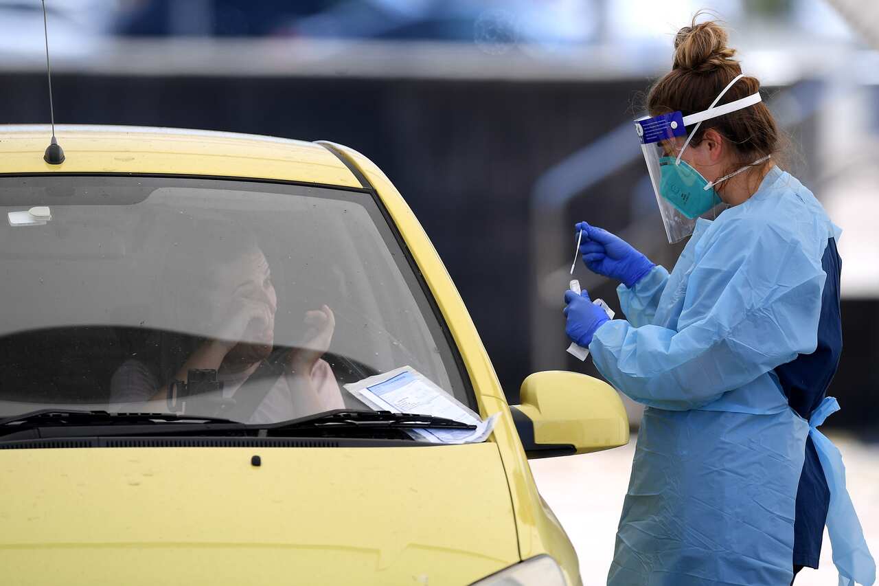 A person is seen being tested at a coronavirus testing facility at Bondi Beach in Sydney, Thursday, October 15, 2020. COVID-19 clusters in Sydney continue to grow, with authorities issuing new alerts. (AAP Image/Dan Himbrechts) NO ARCHIVING