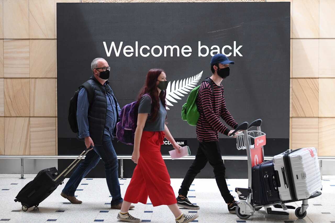 The first lot of passengers from New Zealand arrive at Sydney International Airport on Friday. 