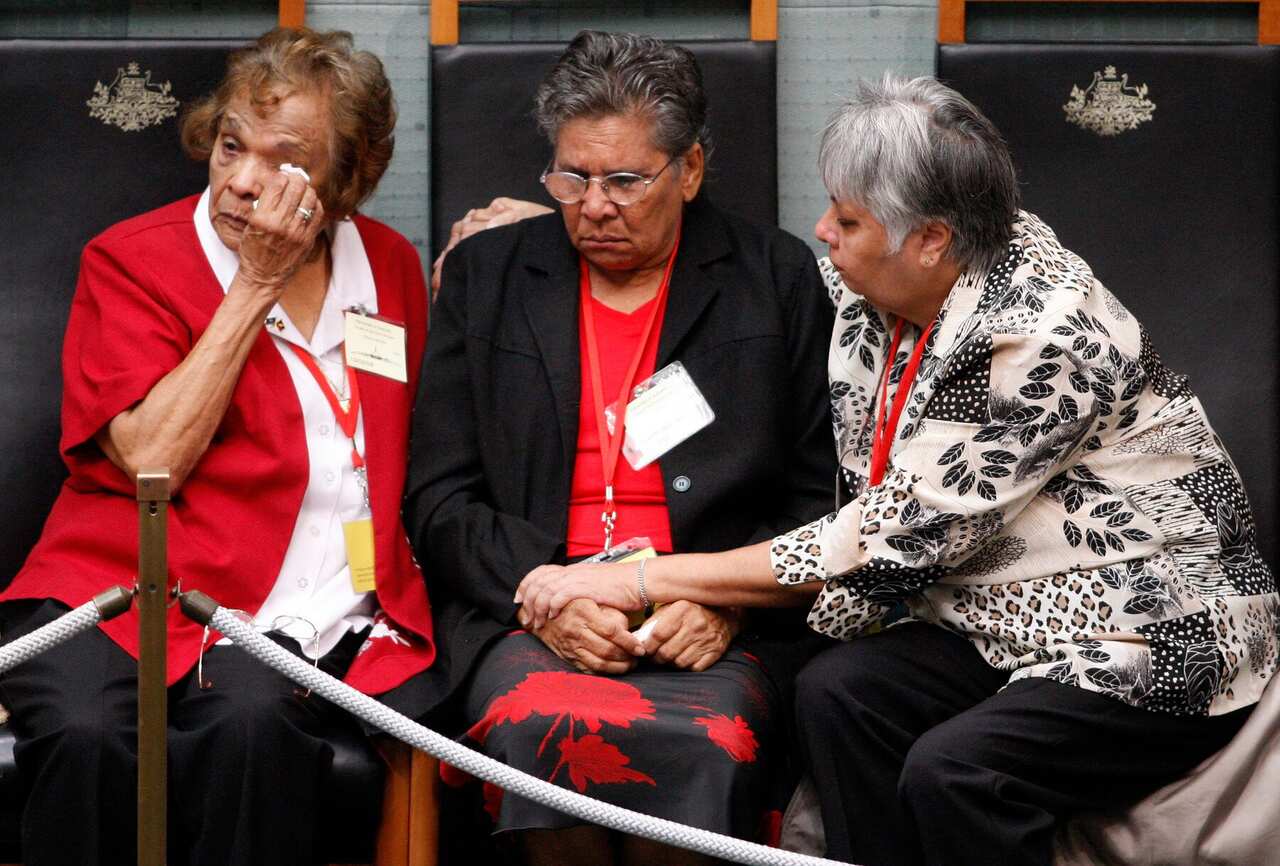 Stolen Generations members listen to Prime Minister Kevin Rudd deliver the Apology in 2008