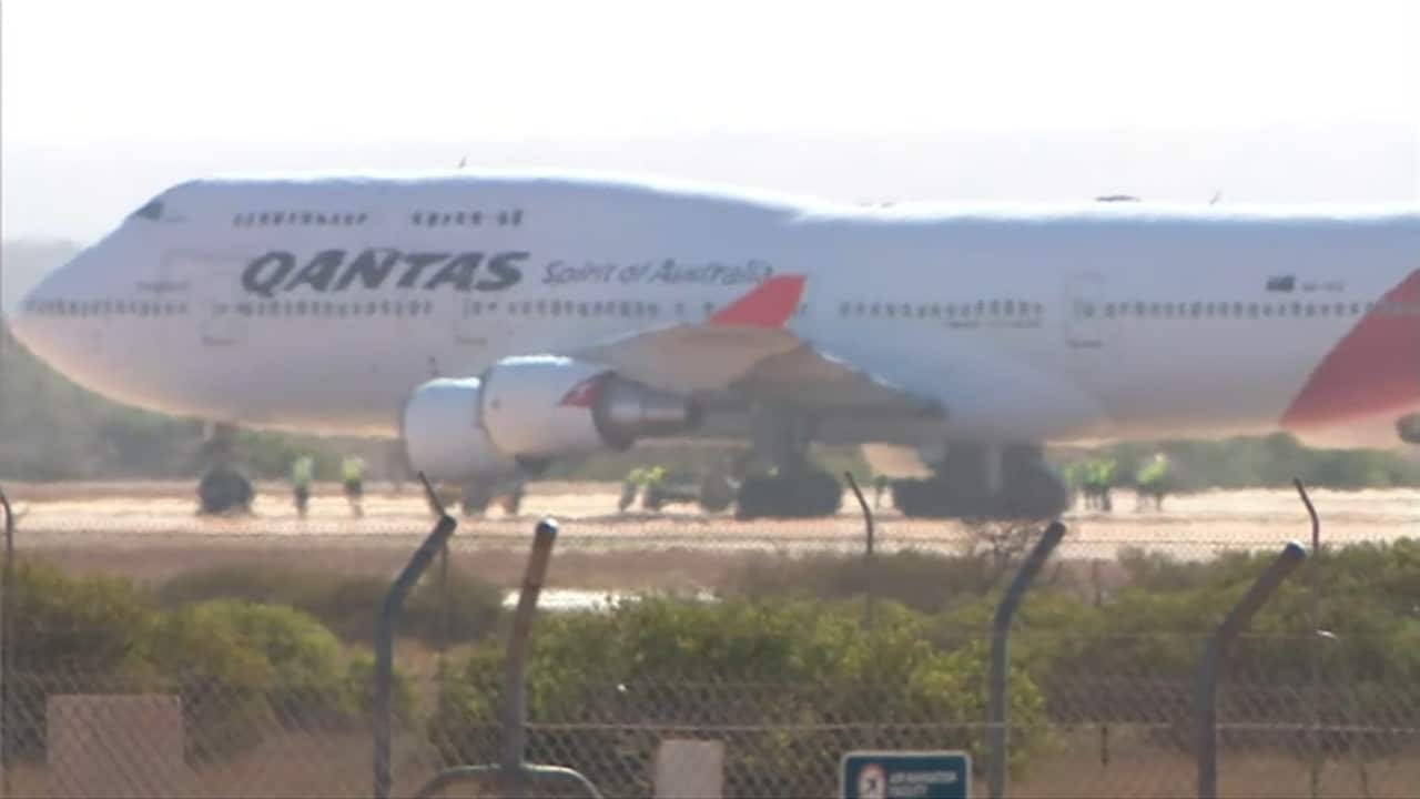 The plane lands in WA.