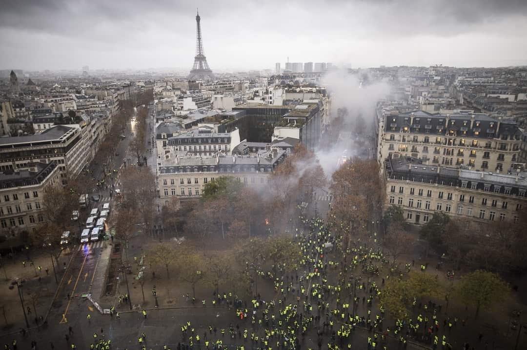 Protesters wear yellow vests, a symbol of a French drivers protest against higher diesel taxes.