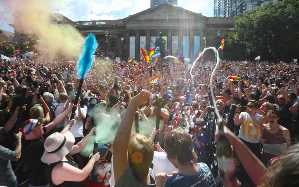 The crowd react to the same-sex marriage postal survey Yes result in front of the State library of Victoria in Melbourne