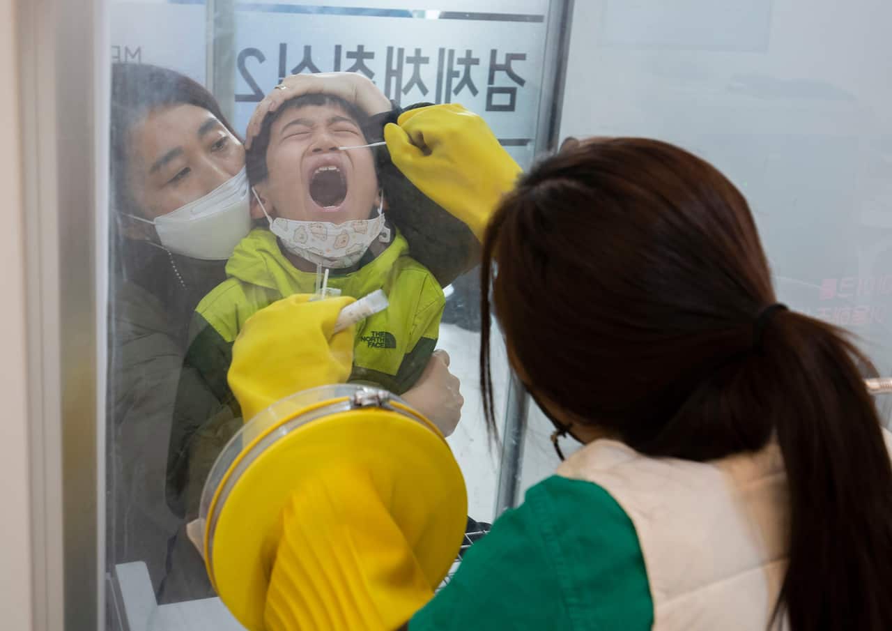 A child is tested for COVID-19 in Seoul, South Korea on 11 December.