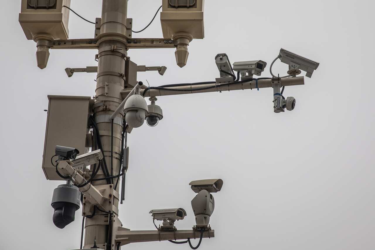 A lamp post hosting surveillance cameras near Tiananmen Square in Beijing. 
