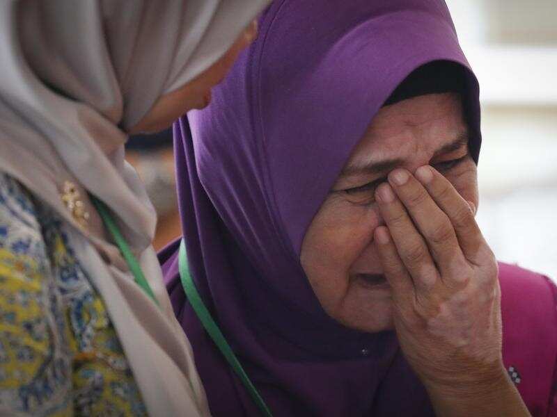 Mother of MH370 passenger cries after briefing