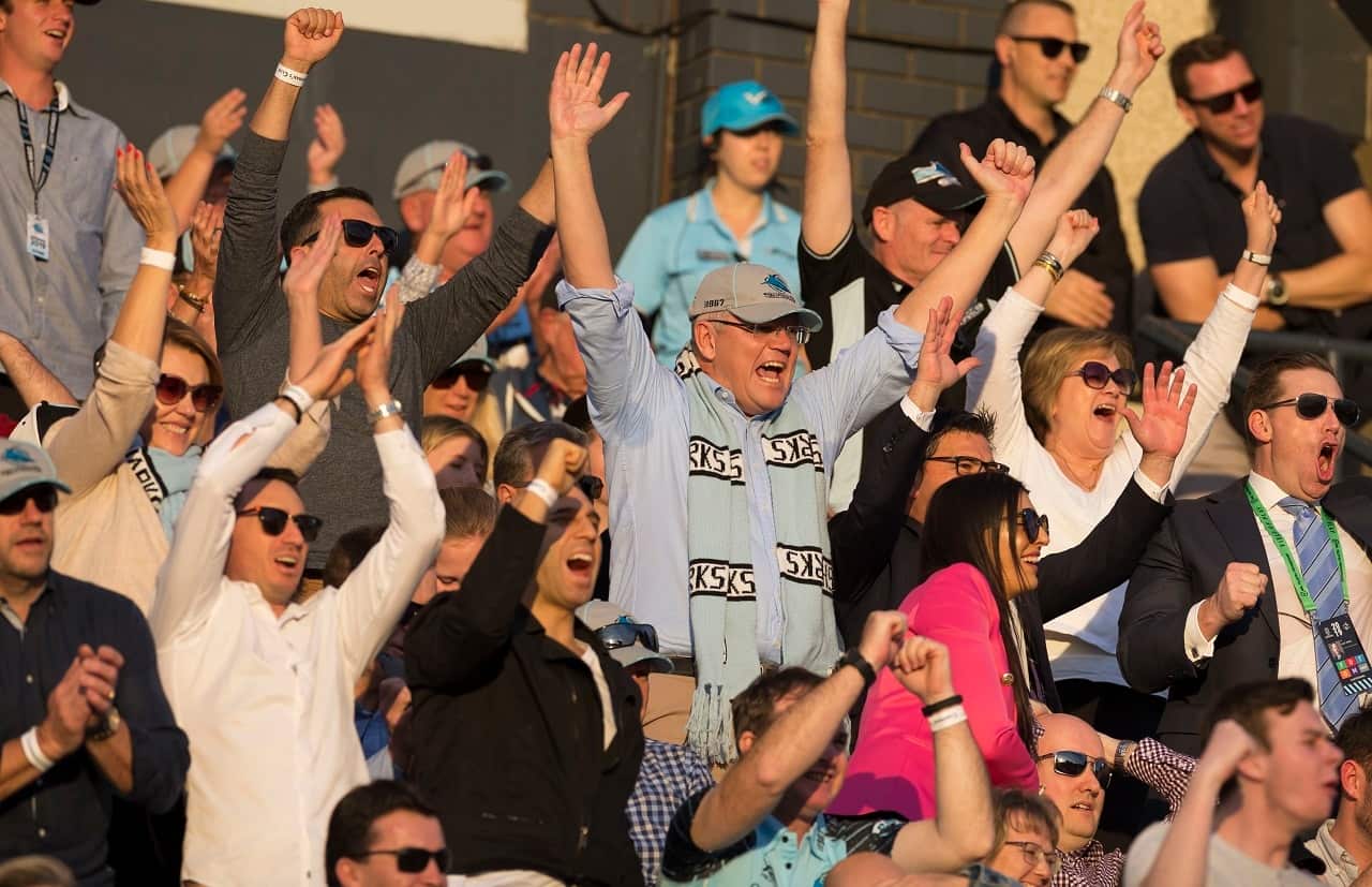 Scott Morrison celebrates at a Sharks game.