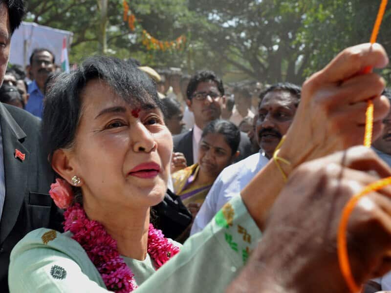 Nobel Peace Laureate and Myanmar pro-democracy leader Aung San Suu Kyi unveils a plaque at Paapsanipalli village during her week-long visit to India. 