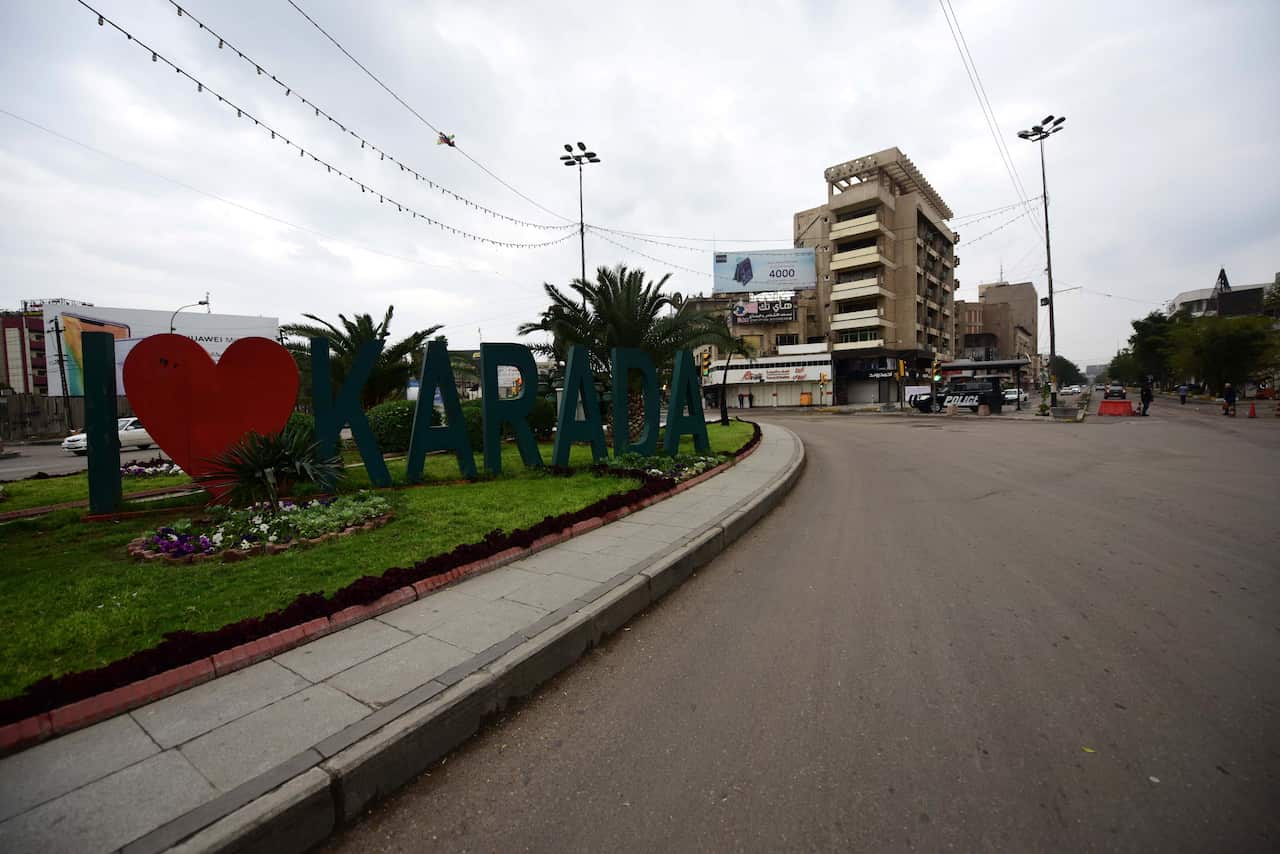 epa08303430 A general view of an empty street during precautionary measures against the novel coronavirus outbreak in central Baghdad, Iraq, 18 March 2020. The Iraqi authorities has imposed a curfew in the capital Baghdad, and suspended all flights to and