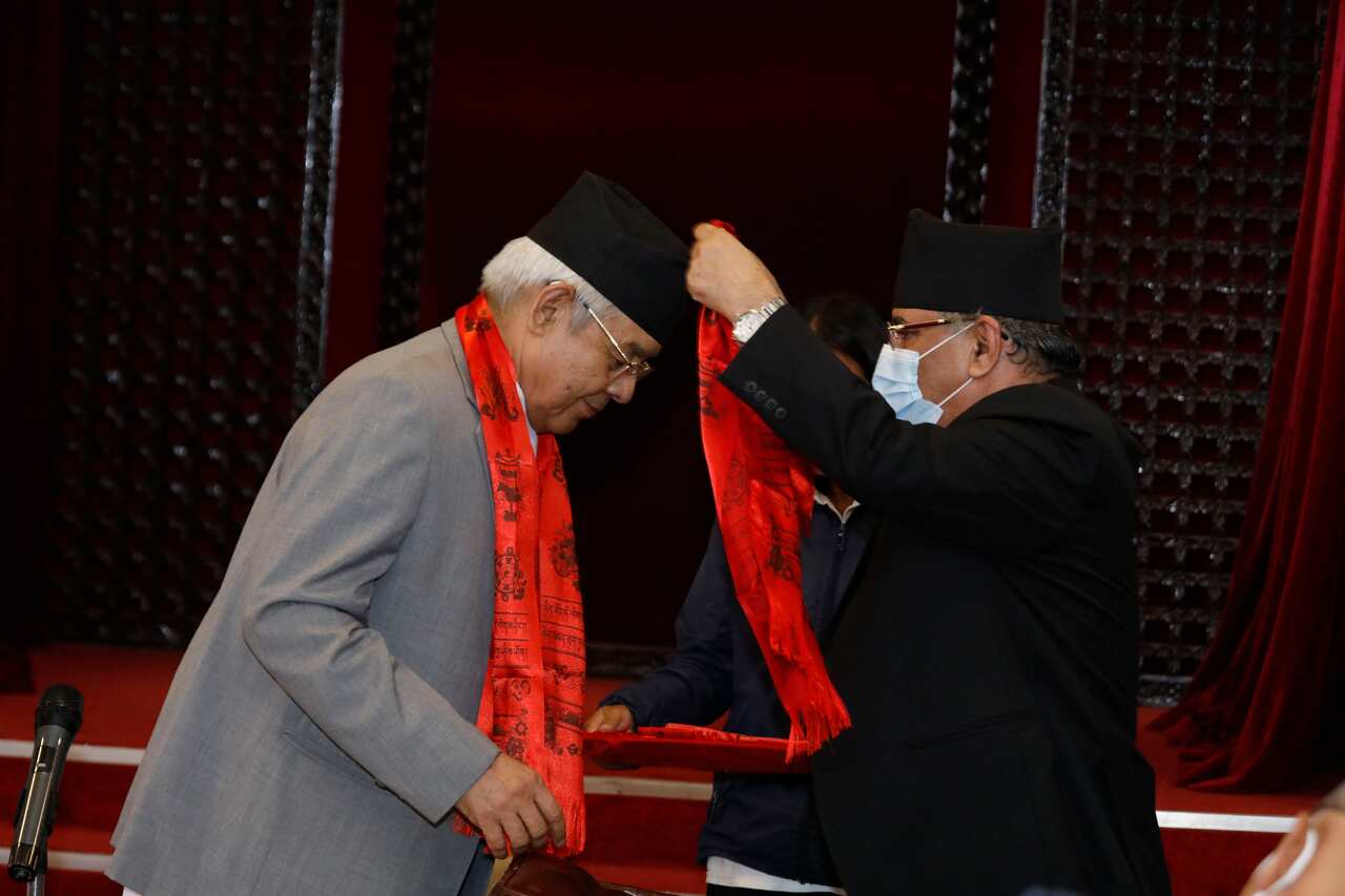 NCP leader Pushpa Kamal Dahal congratulation newly appointed member of his party Bam Dev Gautam into the National Assembly.