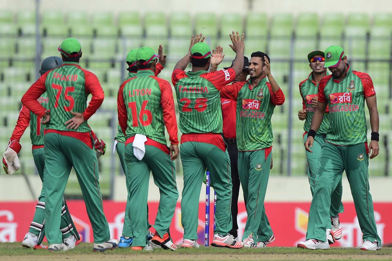 Bangladeshi cricketers celebrate after the dismissal of the South Africa cricketer Rilee Rossouw during the second ODI (One Day International) cricket match between Bangladesh and South Africa at the Sher-e-Bangla National Cricket Stadium in Dhaka on Jul