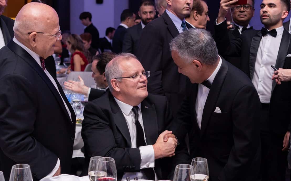Basir Abbass handshakes with PM Morrison