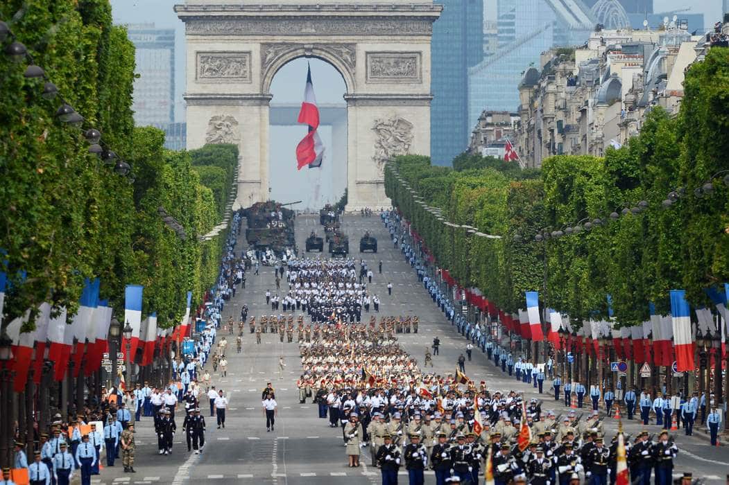 Troops march down the Champs-Elysees avenue during the annual Bastille Day military in Paris, on July 14, 2014.  AFP PHOTO / ALAIN JOCARD