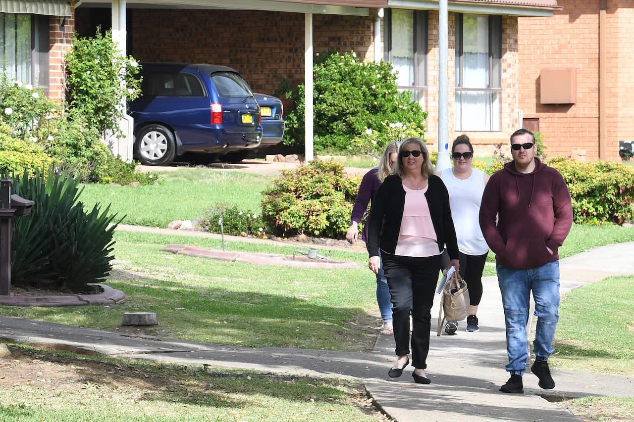 Louise Payne, who has a family member living at Anglicare's Newmarch House arrives with family and friends at the agedcare home in Kingswood, near Penrith, NSW.