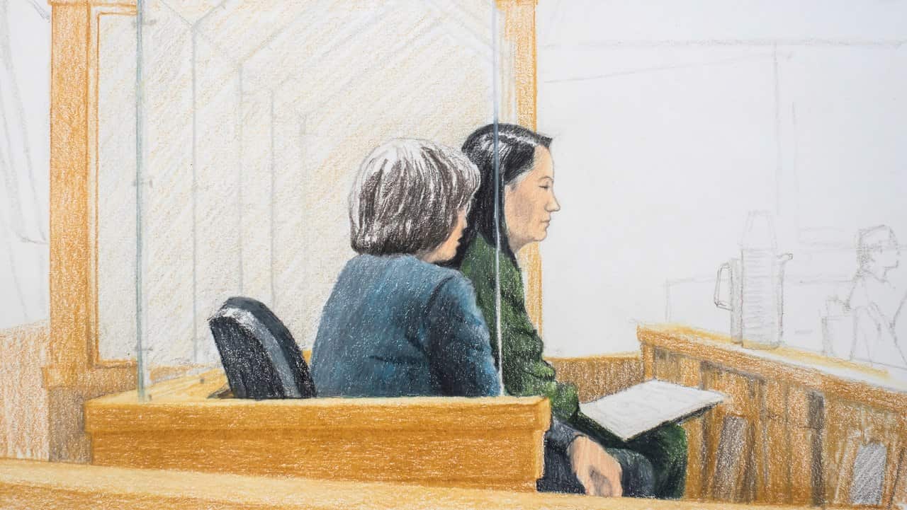 In this courtroom sketch, Meng Wanzhou, right, the chief financial officer of Huawei Technologies, sits beside a translator during a bail hearing.