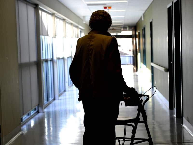 A woman uses a walker