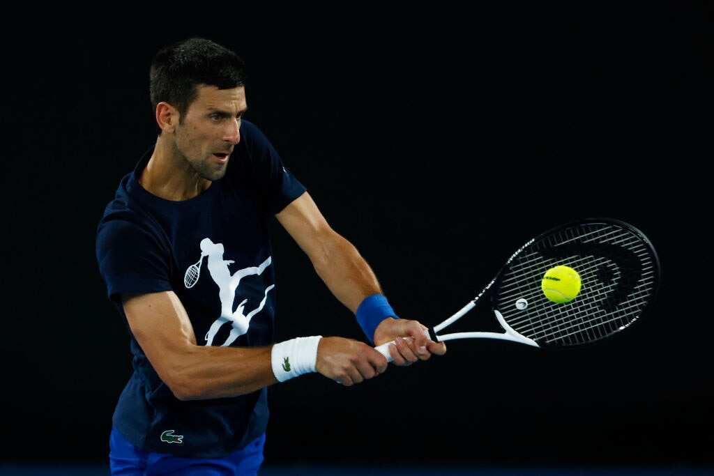 Novak Djokovic plays a backhand during a practice session ahead of the 2022 Australian Open at Melbourne Park on 14 January 2022.