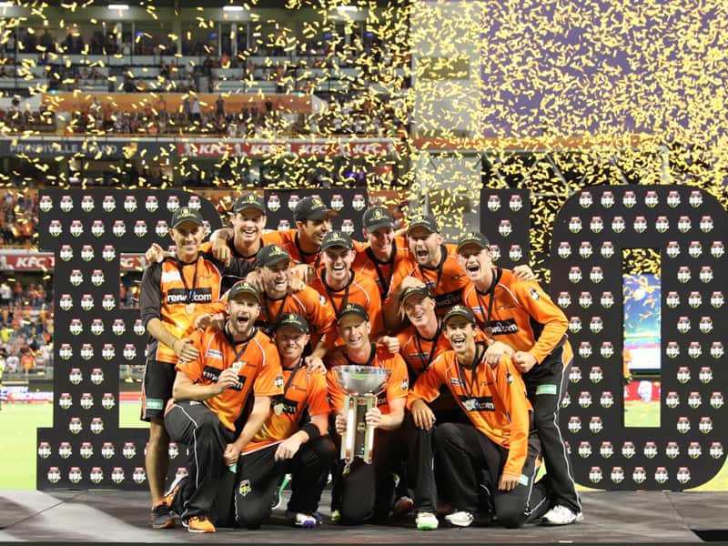 The Scorchers celebrate after winning the BBL