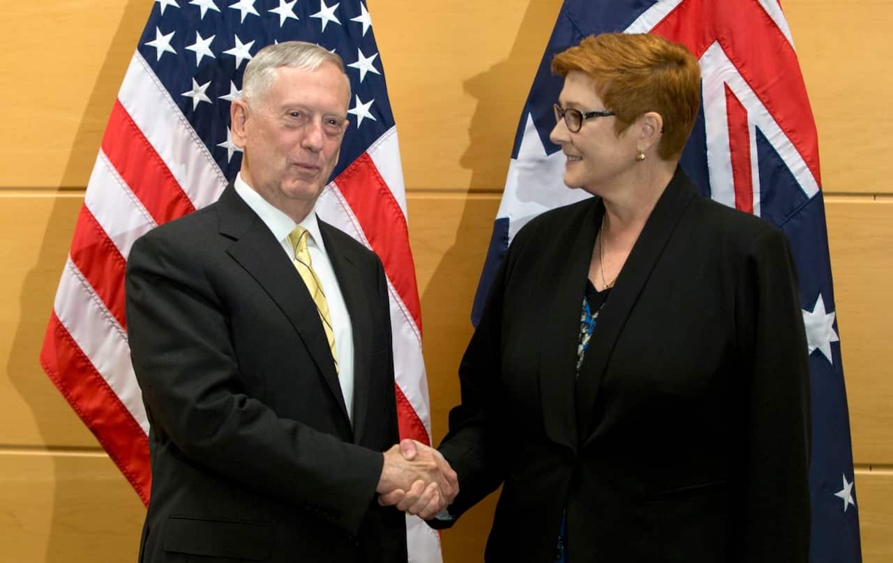 Australia's Defense Minister Marise Payne, right, shakes hands with U.S. Secretary of Defense Jim Mattis prior to a meeting at NATO headquarters in Brussels 