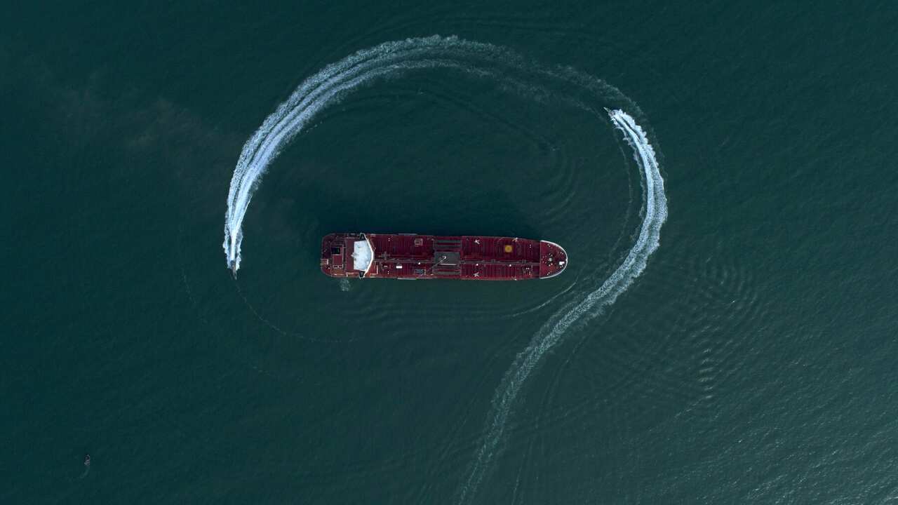 Speedboats from Iran's Revolutionary Guard circle a British-flagged oil tanker after it was seized in the Strait of Hormuz
