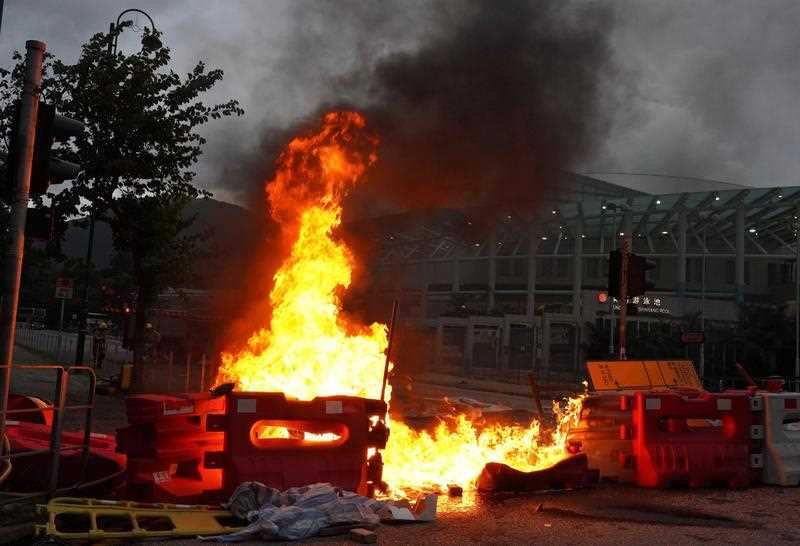  Protesters set barricades on fire near the Tung Chung MTR station in Hong Kong