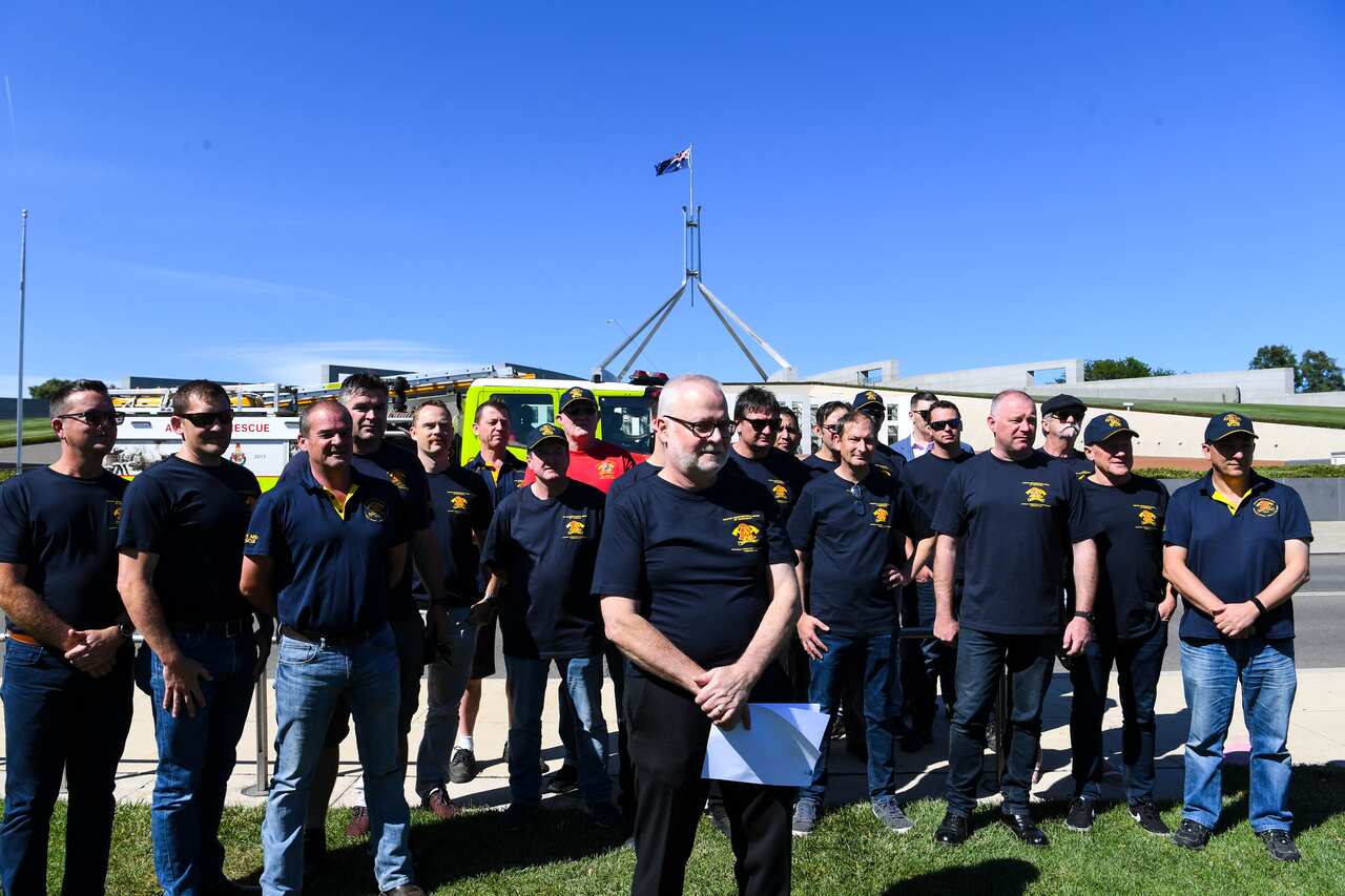 Members of the United Firefighters Union of Australia during a rally demanding a national approach to climate change in Canberra, December 2019.