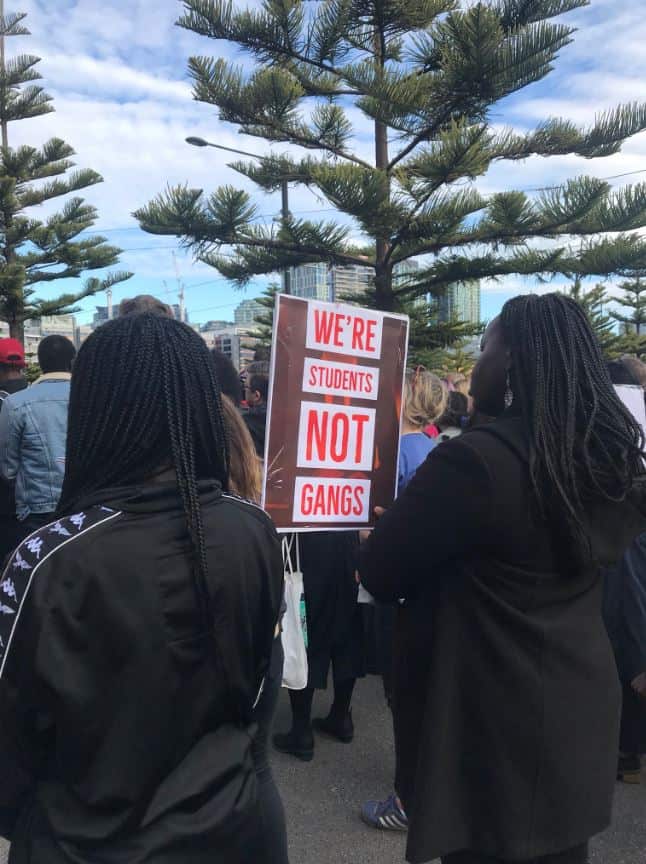 Protesters held signs stating "We're students, not gangs" at the Channel 7 protest in Melbourne.