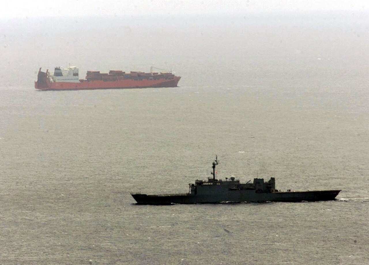 An Australian navy ship sails near the the Tampa in 2001.