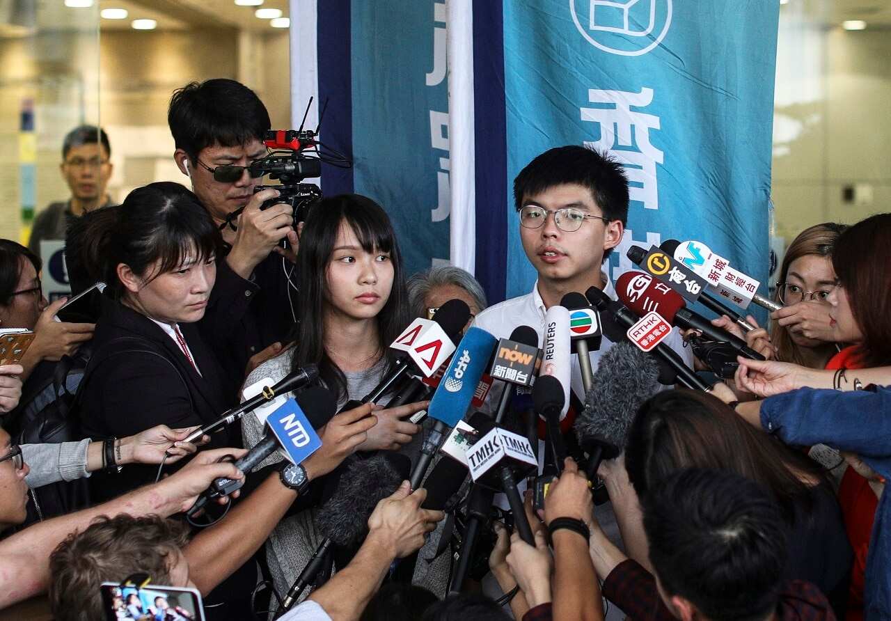 Joshua Wong talks to the press last month after being released on bail.
