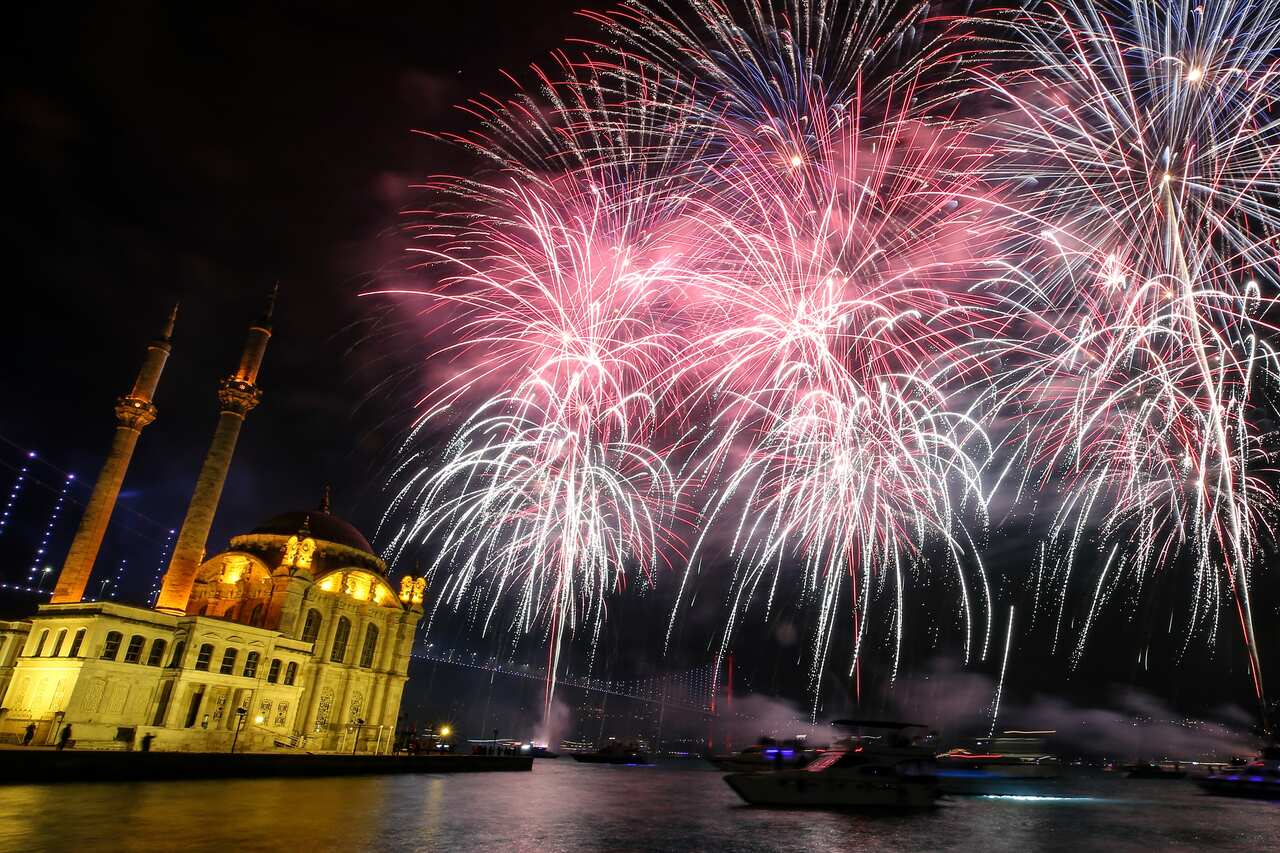 Fireworks explode over the Ottoman-era Mecidiye mosque in Ortakoy square and the "July 15th Martyrs' bridge.