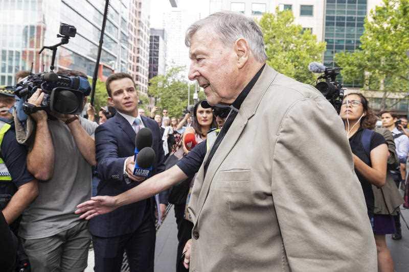 Cardinal George Pell emerges from court on Tuesday. He will return to court for a pre-sentencing hearing.